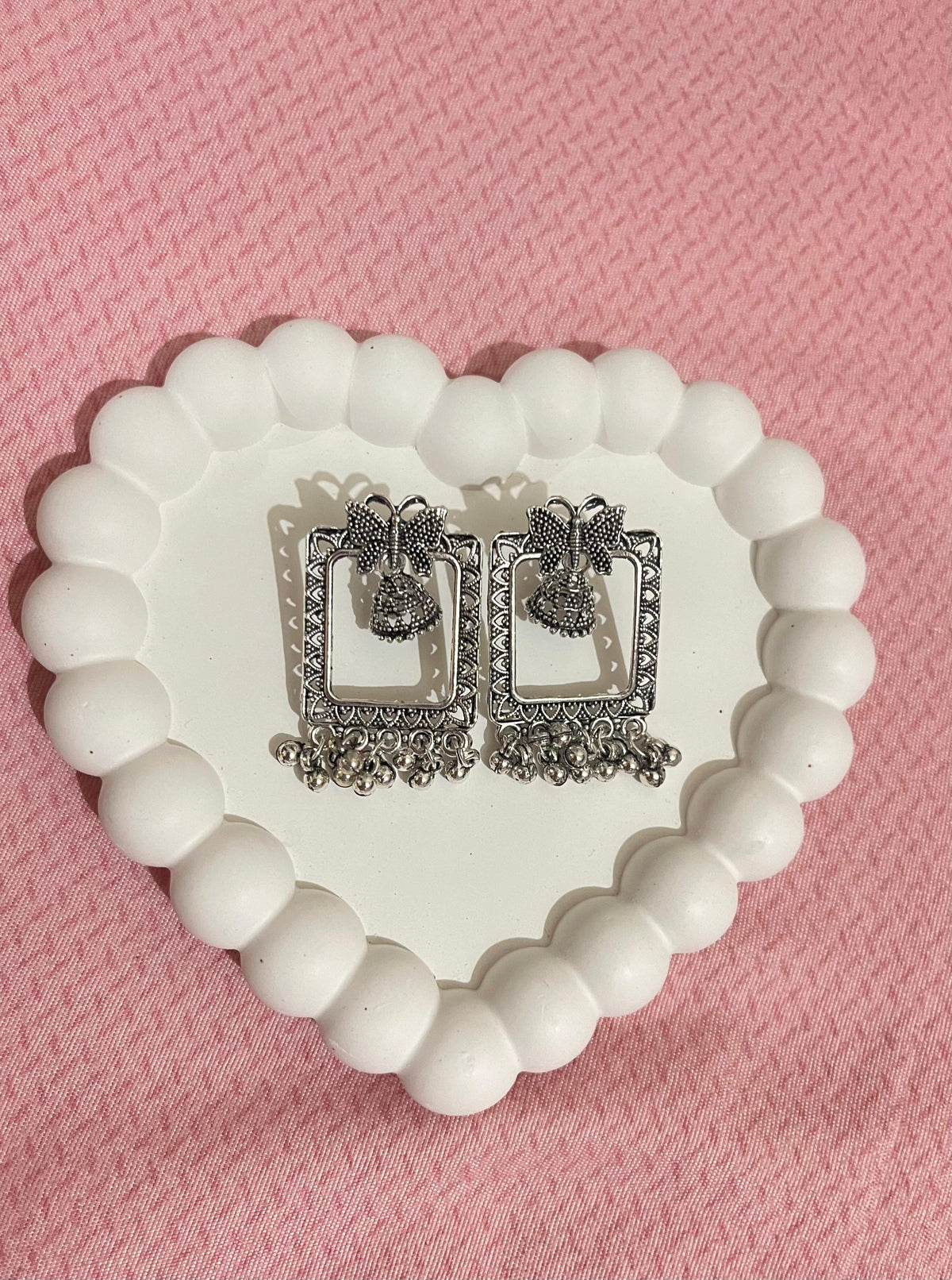 Bow Frame Oxidized Silver Jhumka Earrings